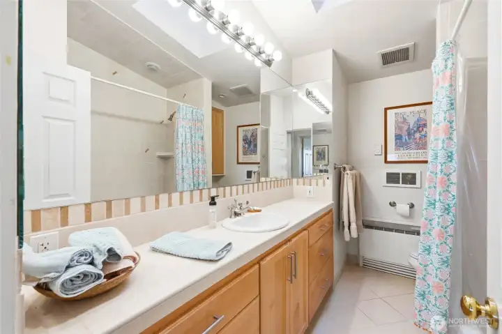 The other upper level full bathroom serves one bedroom.