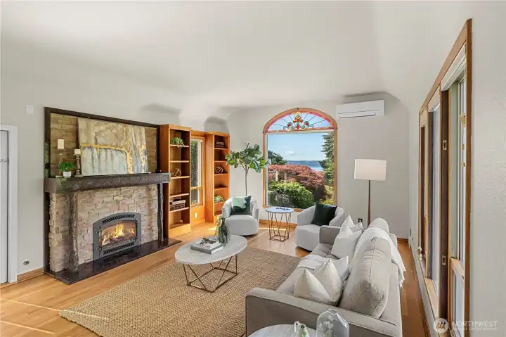 Living room w/ cozy fireplace & sound views