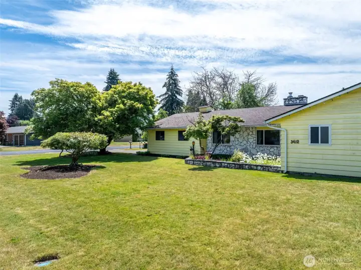 Large front yard .32-acre corner lot. Large front yard .32-acre corner lot.