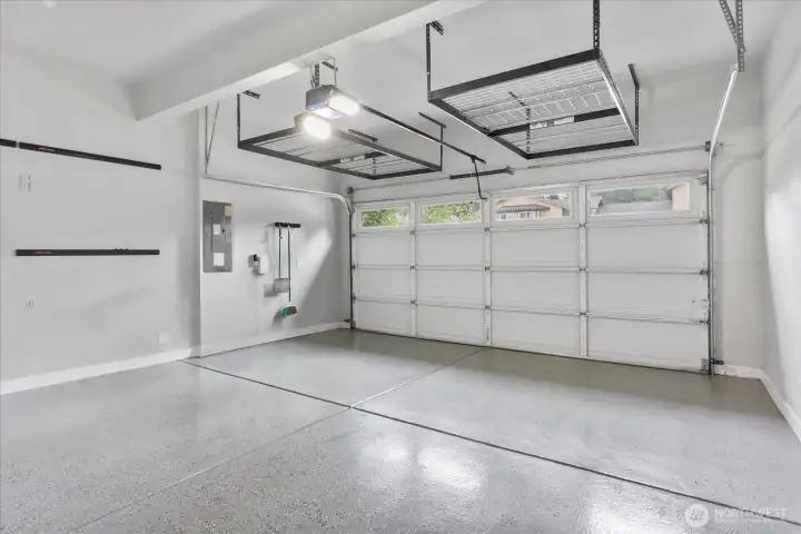 Garage with Epoxy Flooring and Storage Solutions Added Garage with Epoxy Flooring and Storage Solutions Added