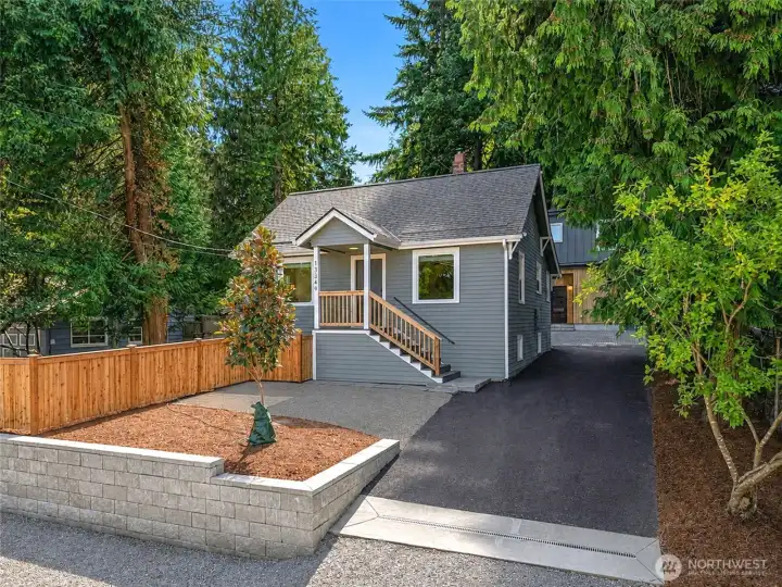 Shared driveway to the right of the house leads to two new construction homes behind the house. Shared driveway to the right of the house leads to two new construction homes behind the house.