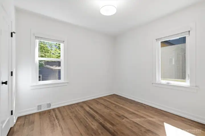 Second bedroom on the main floor has gorgeous hardwoods and all new paint. Second bedroom on the main floor has gorgeous hardwoods and all new paint.