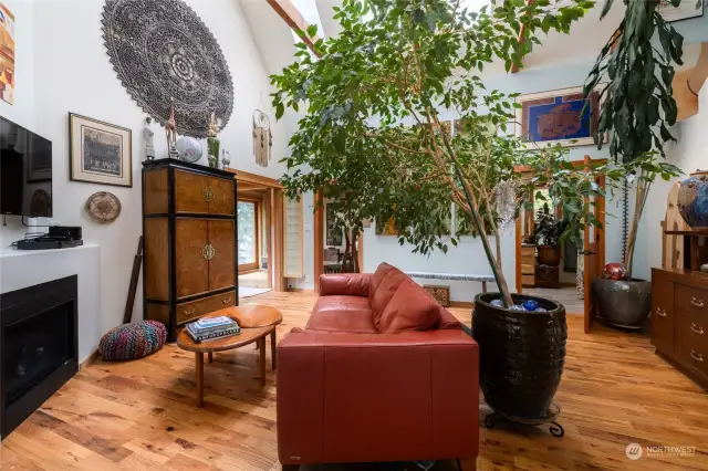 Main living area with lots of light from double height space with skylights.