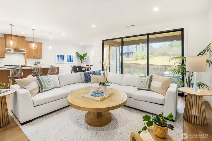 The great room is perfect for bringing the outdoors, inside with multi-slide door that opens to an oversized covered patio with gas fireplace.