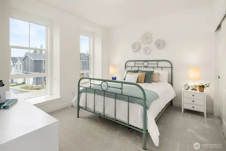 Central to a generous loft space, secondary bedrooms feature sizable closets and a shared hall bath with dual vanity sinks