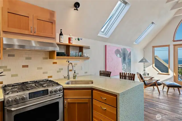 Fully functional kitchen with stainless appliances.