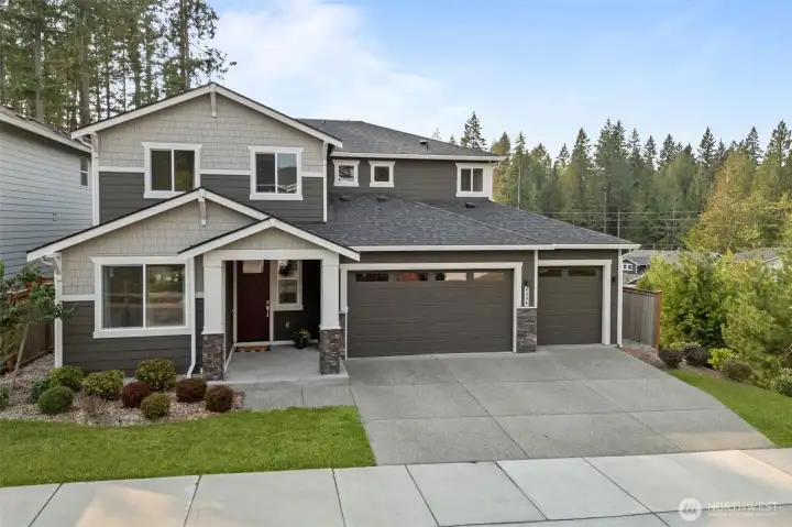 Gorgeous Century Home on a sought after corner lot in Amherst! Three car garage and ample privacy.