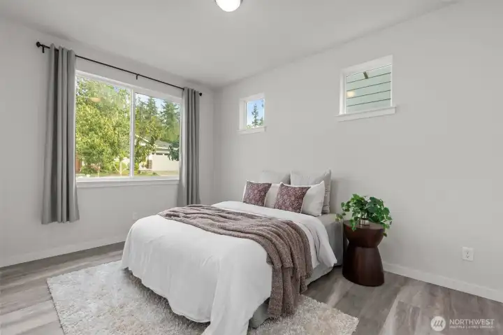 The main floor bedroom is well-sized with an on-suite bathroom! Perfect for guest room, multi-gen, or office/flex space!