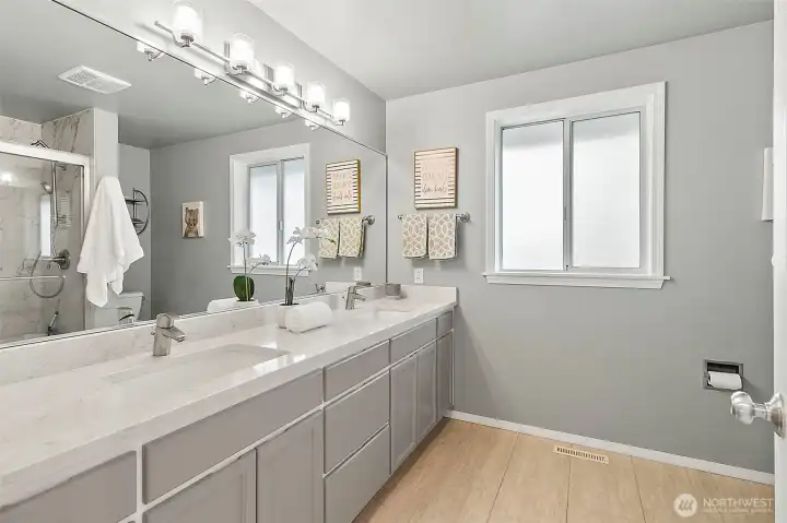 Upstairs hall bath has been redone with walk in shower and updated finishes