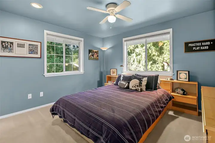 Third bedroom with natural light overlooking large grassy area