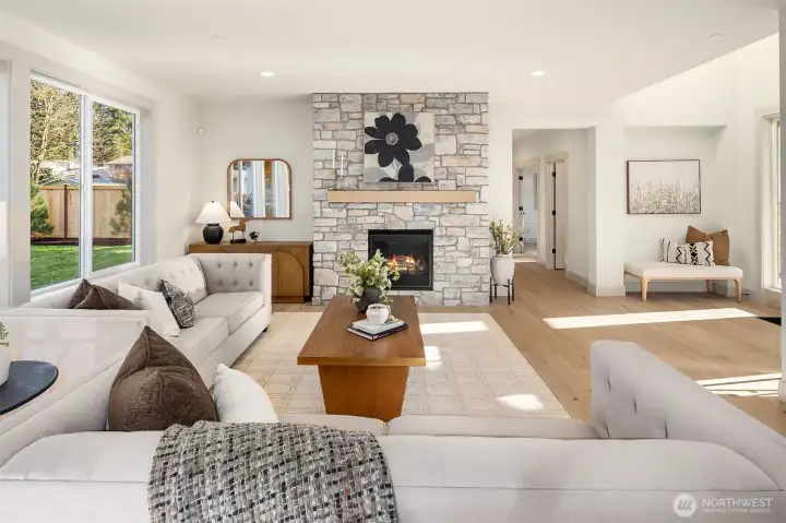 Cozy Fireplace & Tall Ceiling make this Space Inviting