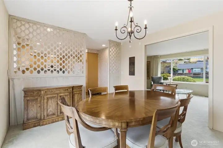 Separate dining room connecting seamlessly to the living room and kitchen