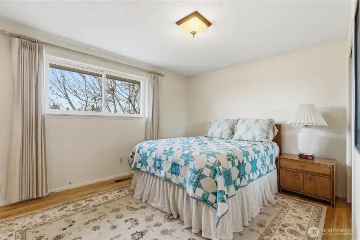 Wood floors in the primary room add warmth