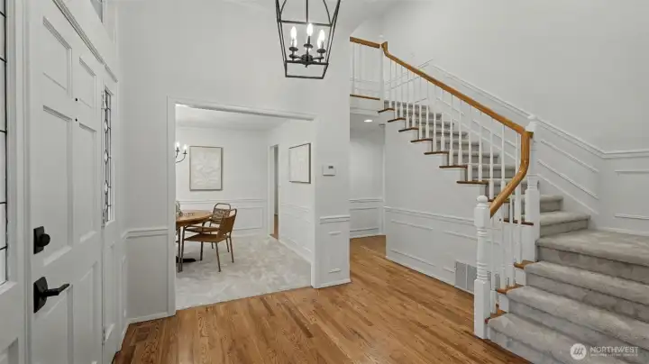 Grand entry way showcases the refinished hardwood floors, refreshed paint, and new carpets.