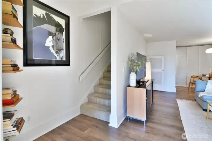 Stairs to upper entry level with bed and bath