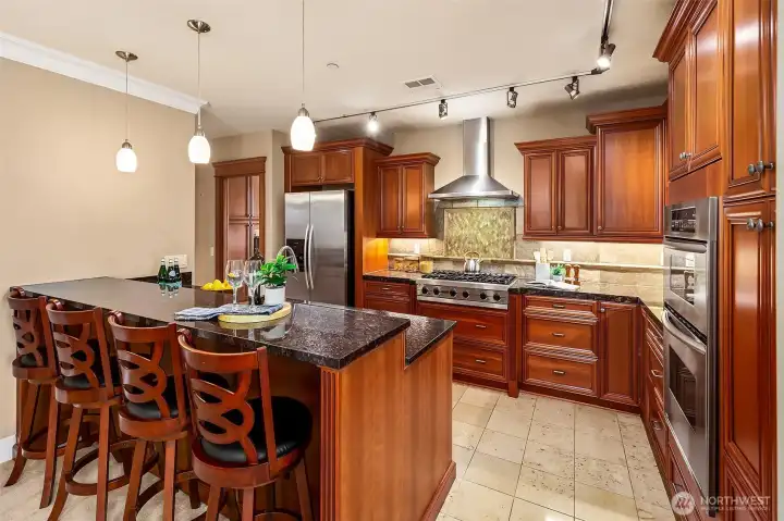 Dramatic interior finishes include wood trim, crown moldings and tile.