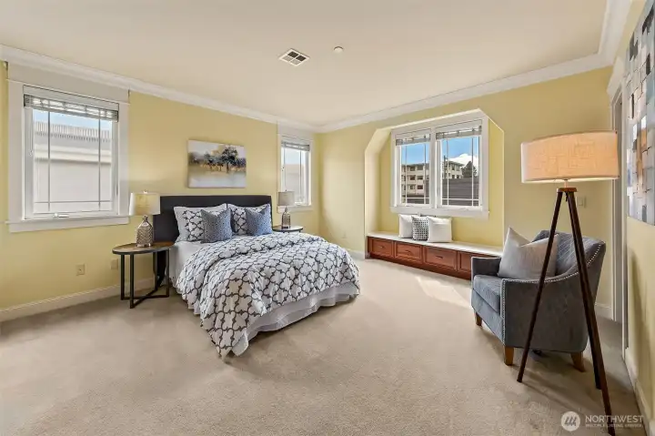 Luxurious primary suite with window seat.