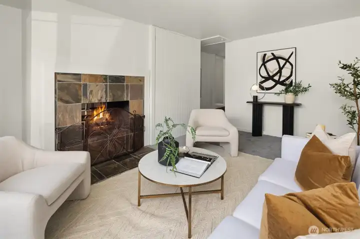 Rec/media room with wraparound fireplace.