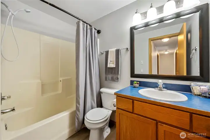 Full upstairs bathroom conveniently located near secondary bedrooms.
