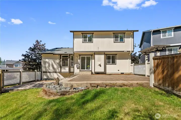 Large fully fenced backyard with room for play, pets, and entertaining.