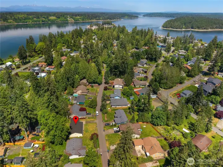 Aerial view of Carlyon Beach neighborhood near Puget Sound, marina, beach, and community amenities. Aerial view of Carlyon Beach neighborhood near Puget Sound, marina, beach, and community amenities.