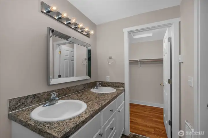 Primary bathroom offers vanity storage, mirror lighting, and direct access to the walk-in closet. Primary bathroom offers vanity storage, mirror lighting, and direct access to the walk-in closet.