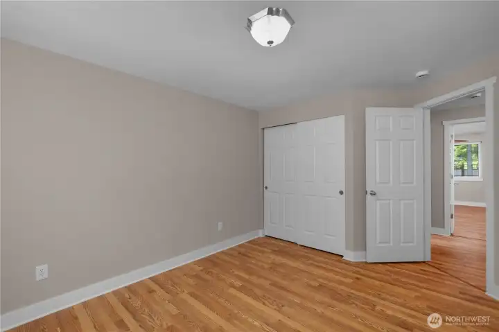 BR 3 - Bedroom with closet, updated flooring, fresh interior paint, and easy access to nearby living areas. BR 3 - Bedroom with closet, updated flooring, fresh interior paint, and easy access to nearby living areas.