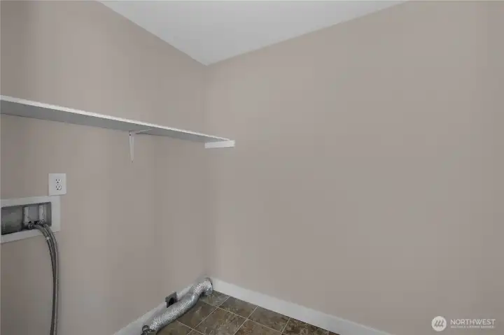 Handle laundry with ease in the dedicated utility room with storage shelf and appliance hookups. Handle laundry with ease in the dedicated utility room with storage shelf and appliance hookups.