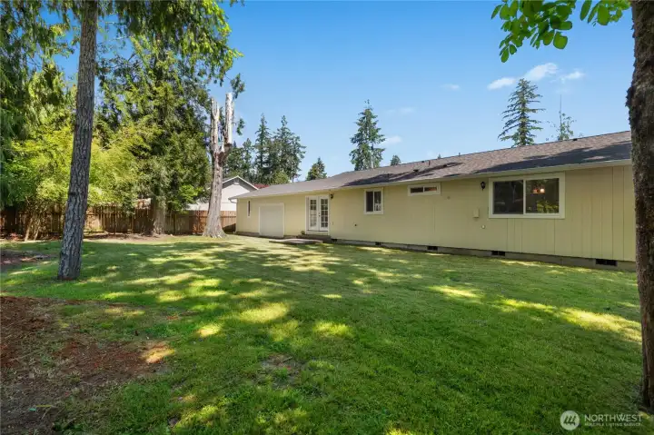 Step outside from this one-level rambler and enjoy the generous backyard and overhead rear garage access. Step outside from this one-level rambler and enjoy the generous backyard and overhead rear garage access.