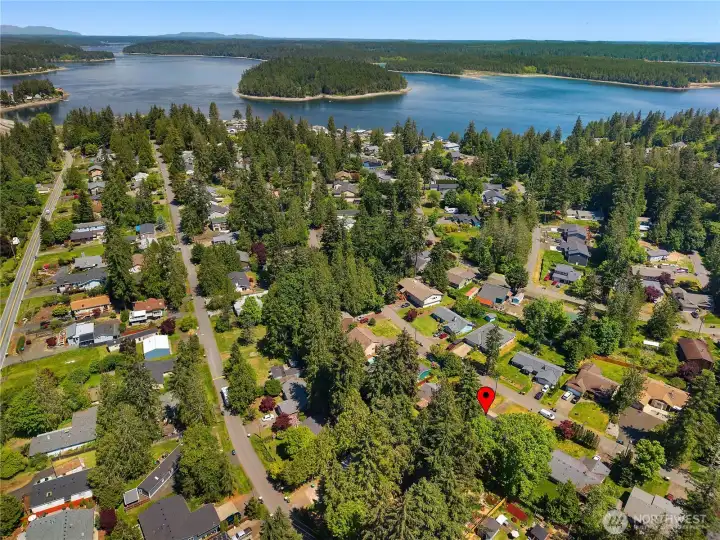 Aerial view shows the home’s location within the Carlyon Beach community near the waterfront and marina. Aerial view shows the home’s location within the Carlyon Beach community near the waterfront and marina.
