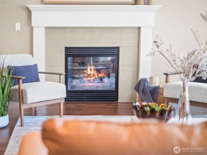 A cozy gas fireplace anchors the great room
