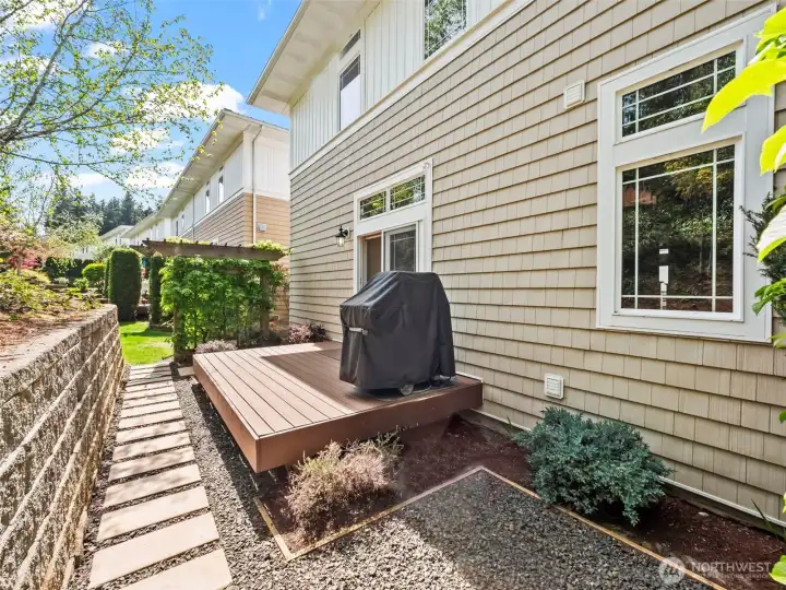 The deck off the kitchen is the perfect spot to grill , with a gas-plumbed line for convenience