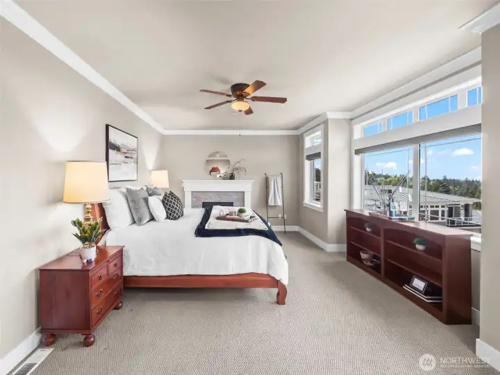 The primary suite is oversized and inviting, with a second gas fireplace...