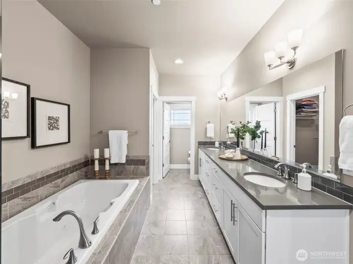 The 5-piece primary ensuite will surprise in size