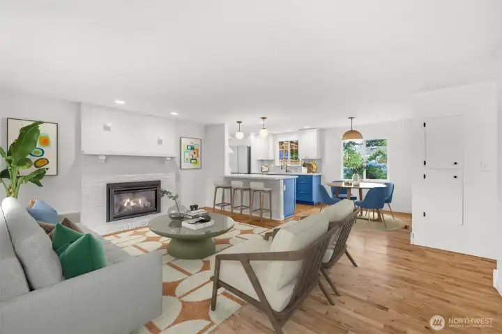 Sunny living room with hardwood floors, gas fireplace and power blinds. This photo virtually staged. Sunny living room with hardwood floors, gas fireplace and power blinds. This photo virtually staged.