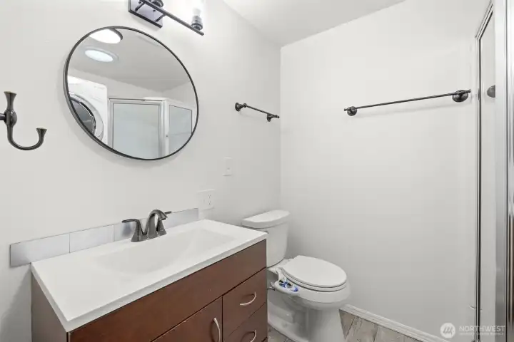 Updated 3/4 bath with laundry and solatube for natural light. Updated 3/4 bath with laundry and solatube for natural light.