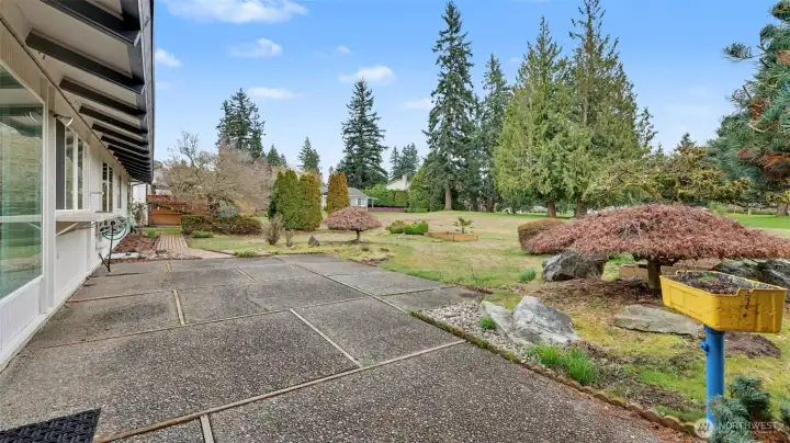Step outside to a spacious patio perfect for relaxing, entertaining, and enjoying the peaceful backyard setting.