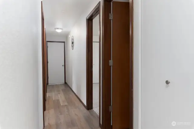Hallway to bedrooms and garage