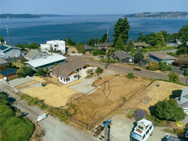 This lot could provide a great water view, even if it was a one story home because of it's elevations, Enter from back alley to access with no steps.  Boundary approx