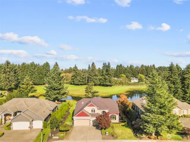 CENTER HOME (Old red front...) Shows Hole #2 - Showing the pond behind.
