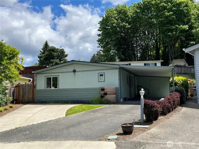 Front of home faces Southwest.  Attached 1 car carport plus 2 additional driveway parking spaces.