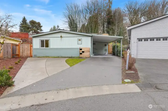 Front of home faces Southwest.  Attached 1 car carport plus 2 additional driveway parking spaces.