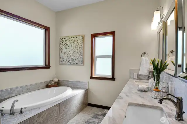 Primary spa-like bath with huge shower, and walk-in closet