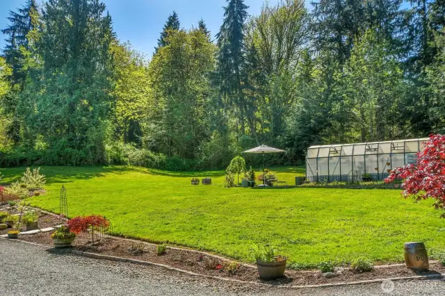 Charming gardens and greenhouse.