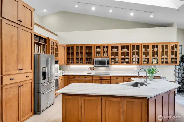 Chef's dream with quartzsite counters, hemlock cabs and gleaming appls.