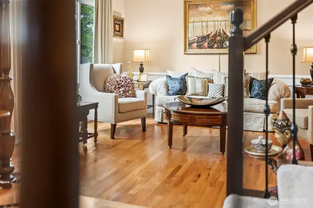 The black wrought iron showcases the double wide staircase.