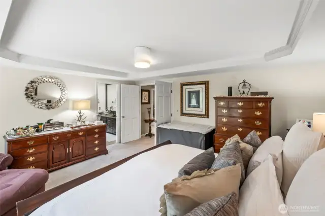 Double doors entering will lead you back out to two additional bedrooms and a double sink guest bath but first check out your primary suite.