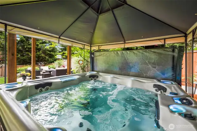 Enjoy the hot tub protected by the 10x10 gazebo.