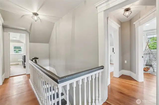 Upstairs hallway – original hardwoods preserved