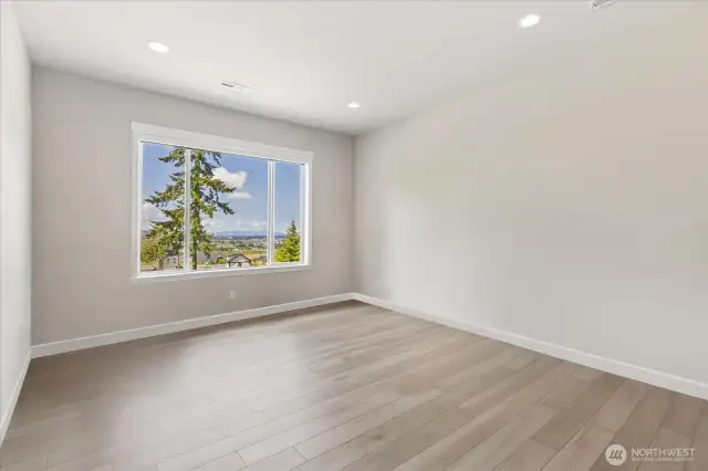 Office/Bonus Room features wonderful valley views.  Automated shades in this room as well!  Current owner uses this as an office (for listing purposes, personal belongings have been digitally removed).